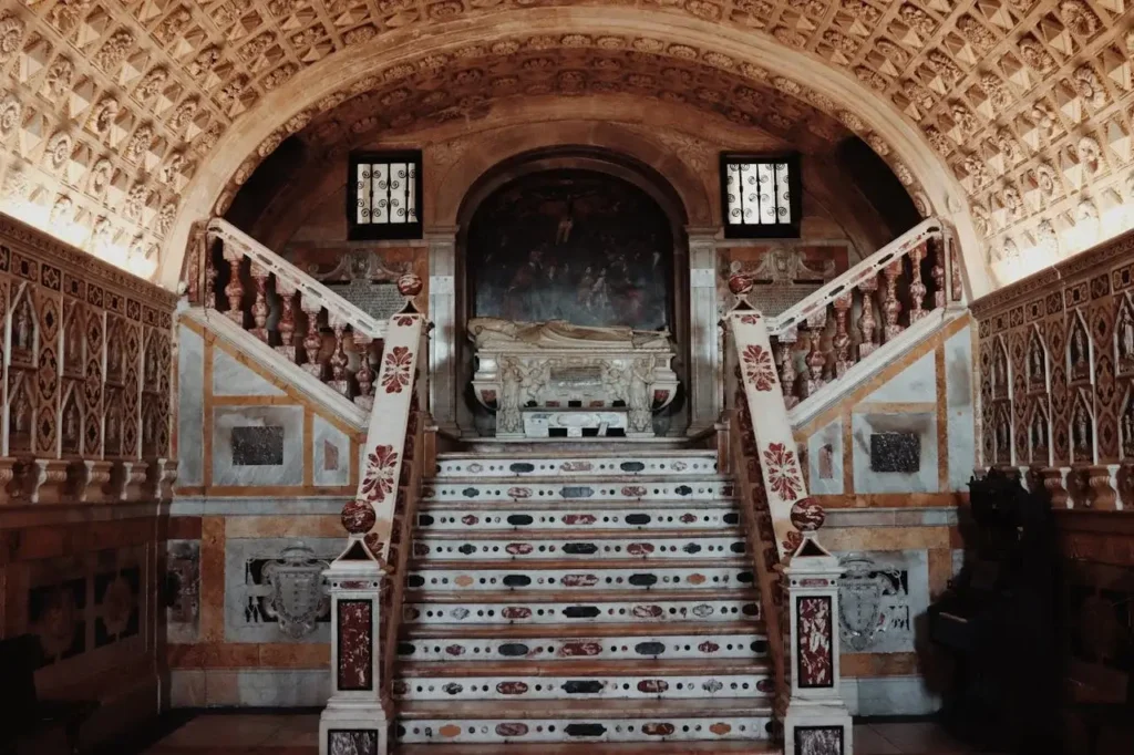 a staircase with a tomb in the middle